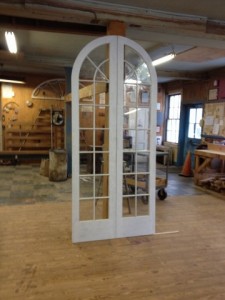 Wood custom arched top storm doors