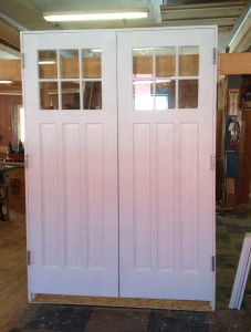 Custom wood double entryway door unit.