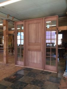 Custom wood mahogany door unit with side light units