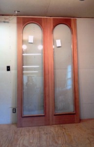 Custom wood inner arched top double storm doors