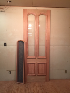 Wood storm screen door